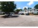 Paved parking area surrounded by mature trees and well-maintained condominium buildings at 1911 Falls Landing Dr # 103, Raleigh, NC 27614