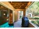 Relaxing covered patio with string lights, perfect for outdoor dining and lounging at 1911 Falls Landing Dr # 103, Raleigh, NC 27614