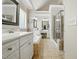 Elegant bathroom with shower, separate vanities, soaking tub and tile flooring at 2328 Forestbluff Dr, Fuquay Varina, NC 27526