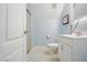 Clean bathroom features a walk-in shower, sleek vanity with modern mirror, and neutral decor for a minimalist design at 2328 Forestbluff Dr, Fuquay Varina, NC 27526