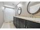 Bathroom boasts a double vanity with granite countertops, modern fixtures, and tiled flooring for a luxurious touch at 2328 Forestbluff Dr, Fuquay Varina, NC 27526