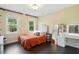 Cozy bedroom features natural light, complementing the warm color palette, with plush bedding and stylish accents at 2328 Forestbluff Dr, Fuquay Varina, NC 27526