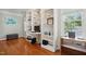 Bright home office with custom built-in shelves, desk area, and large windows allowing for natural light at 2328 Forestbluff Dr, Fuquay Varina, NC 27526