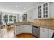 Bright kitchen area featuring granite countertops, and stainless steel dishwasher at 2328 Forestbluff Dr, Fuquay Varina, NC 27526