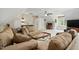 Expansive living room featuring plush seating, a wet bar, and an adjacent computer desk area, offering versatile living at 2328 Forestbluff Dr, Fuquay Varina, NC 27526
