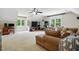 Spacious living room with a large flat-screen TV, and comfortable seating, great for relaxation and entertainment at 2328 Forestbluff Dr, Fuquay Varina, NC 27526