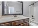 Bathroom featuring a modern vanity, sink, and ample counter space, plus a shower and tub combo at 235 Camden Place St, Princeton, NC 27569