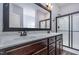 Bathroom features a dual sink vanity with marble countertops and a glass-enclosed shower at 235 Camden Place St, Princeton, NC 27569
