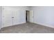 This bedroom offers neutral carpet, pale blue walls, and a large closet at 235 Camden Place St, Princeton, NC 27569