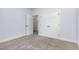 Empty bedroom features a double closet, carpeted floor, and natural light at 235 Camden Place St, Princeton, NC 27569