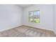 Bedroom with neutral carpet and a window overlooking the front yard at 235 Camden Place St, Princeton, NC 27569