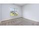 Cozy empty bedroom with neutral carpet and a window at 235 Camden Place St, Princeton, NC 27569