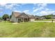 Well-maintained home featuring a landscaped yard, two-car garage and sidewalk at 235 Camden Place St, Princeton, NC 27569