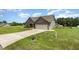 Well-maintained home featuring a landscaped yard, two-car garage and long driveway at 235 Camden Place St, Princeton, NC 27569