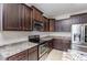 Stylish kitchen features stainless steel appliances, granite countertops, and custom cabinetry at 235 Camden Place St, Princeton, NC 27569