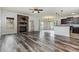 Spacious living room featuring hardwood floors, stone fireplace, and modern finishes at 235 Camden Place St, Princeton, NC 27569