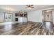 Open-concept living and dining area featuring hardwood floors and abundant natural light at 235 Camden Place St, Princeton, NC 27569