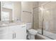 Bathroom featuring granite counters and walk-in shower with glass door at 2527 Sidewinder Ct, Apex, NC 27523
