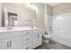 Bright bathroom with double vanity, tile floors, and a shower-tub combination at 2527 Sidewinder Ct, Apex, NC 27523