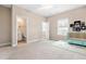 Inviting bedroom with an attached bathroom and blue baby furniture at 2527 Sidewinder Ct, Apex, NC 27523