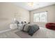 Cozy bedroom featuring neutral decor, a large window, and plush carpeting at 2527 Sidewinder Ct, Apex, NC 27523