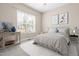 Bedroom features a large window and neutral décor at 2527 Sidewinder Ct, Apex, NC 27523