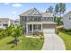 Beautiful brick home featuring a well-manicured lawn and two-car garage at 2527 Sidewinder Ct, Apex, NC 27523
