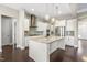 Bright kitchen with granite countertops, pendant lights, and stainless steel appliances at 2527 Sidewinder Ct, Apex, NC 27523