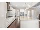 Open kitchen layout featuring an island with seating and modern appliances for cooking and entertaining at 2527 Sidewinder Ct, Apex, NC 27523