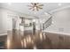 Spacious living room showcasing beautiful hardwood floors, staircase, and open floorplan at 2527 Sidewinder Ct, Apex, NC 27523
