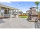 Backyard patio with outdoor fireplace and grilling area perfect for entertaining at 2527 Sidewinder Ct, Apex, NC 27523
