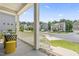 Cozy front porch with white railings and columns, offering a peaceful view of the neighborhood at 2527 Sidewinder Ct, Apex, NC 27523