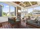 Comfortable sunroom with a fireplace and views of the surrounding houses at 2527 Sidewinder Ct, Apex, NC 27523
