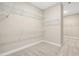 Spacious walk-in closet with multiple wire shelves for optimal storage and organization at 2527 Sidewinder Ct, Apex, NC 27523