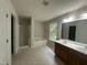 Bathroom with a walk-in shower, soaking tub, double vanity, and tiled floor at 2852 Orchard Trace Way, Raleigh, NC 27610