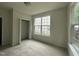 Cozy bedroom with neutral carpet, a large window, and ample closet space at 2852 Orchard Trace Way, Raleigh, NC 27610