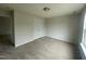 Bedroom with carpet and a double-door closet, providing ample storage and a cozy feel at 2852 Orchard Trace Way, Raleigh, NC 27610