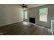 Bright living room featuring a fireplace, hardwood flooring, and natural light at 2852 Orchard Trace Way, Raleigh, NC 27610