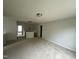 Expansive loft area with plush carpeting, offering a versatile space for recreation or relaxation at 2852 Orchard Trace Way, Raleigh, NC 27610