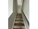 Carpeted staircase with handrail leading to the next level of the home at 2852 Orchard Trace Way, Raleigh, NC 27610
