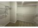 Spacious walk-in closet with carpet and built-in shelving for maximum storage and organization at 2852 Orchard Trace Way, Raleigh, NC 27610