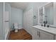 Practical bathroom with modern vanity, ample storage, a toilet, and a shower-tub combo at 303 N Watauga Ave, Dunn, NC 28334