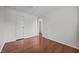 A bright bedroom with wood floors and multiple closets at 303 N Watauga Ave, Dunn, NC 28334