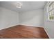 A bright bedroom with wood floors, white walls and a ceiling fan at 303 N Watauga Ave, Dunn, NC 28334