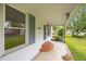 Inviting front porch with brick steps, decorative railings, and a view of the street at 303 N Watauga Ave, Dunn, NC 28334