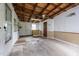 Spacious garage area with unfinished ceiling and concrete flooring at 303 N Watauga Ave, Dunn, NC 28334