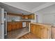 An open concept kitchen with tile and wood flooring and a breakfast bar at 303 N Watauga Ave, Dunn, NC 28334