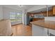 Classic eat-in kitchen with stainless steel appliances, an island, and hardwood floors at 303 N Watauga Ave, Dunn, NC 28334