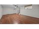 Open living room with a ceiling fan, hardwood floors, and staircase to a bonus room at 303 N Watauga Ave, Dunn, NC 28334