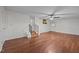 Spacious living room with hardwood floors, wainscoting, and staircase to a bonus area at 303 N Watauga Ave, Dunn, NC 28334